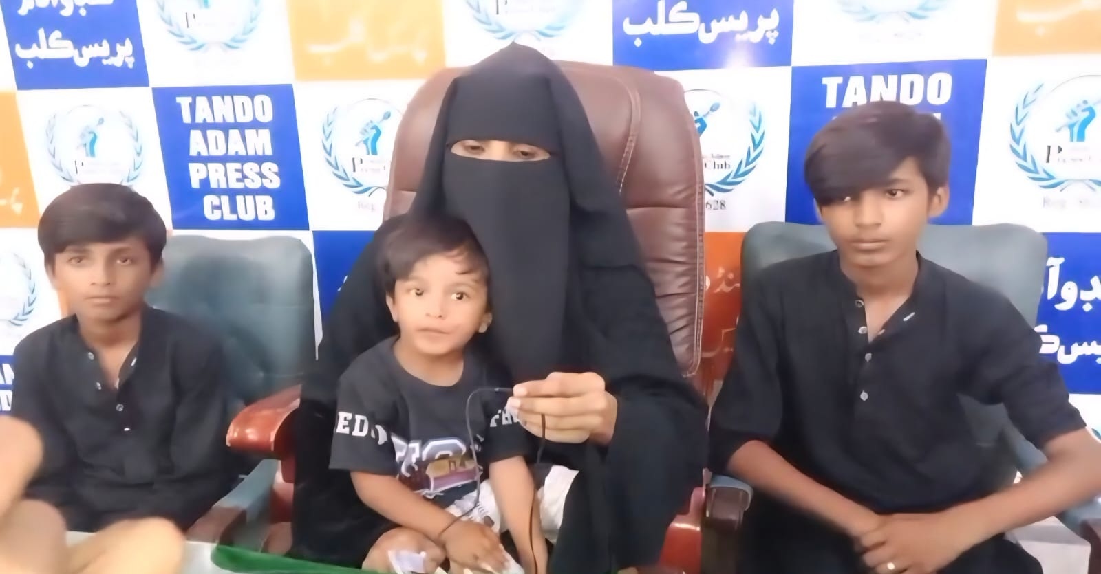 Woman Protests Against Ex-Husband for Alleged Abuse and Threats