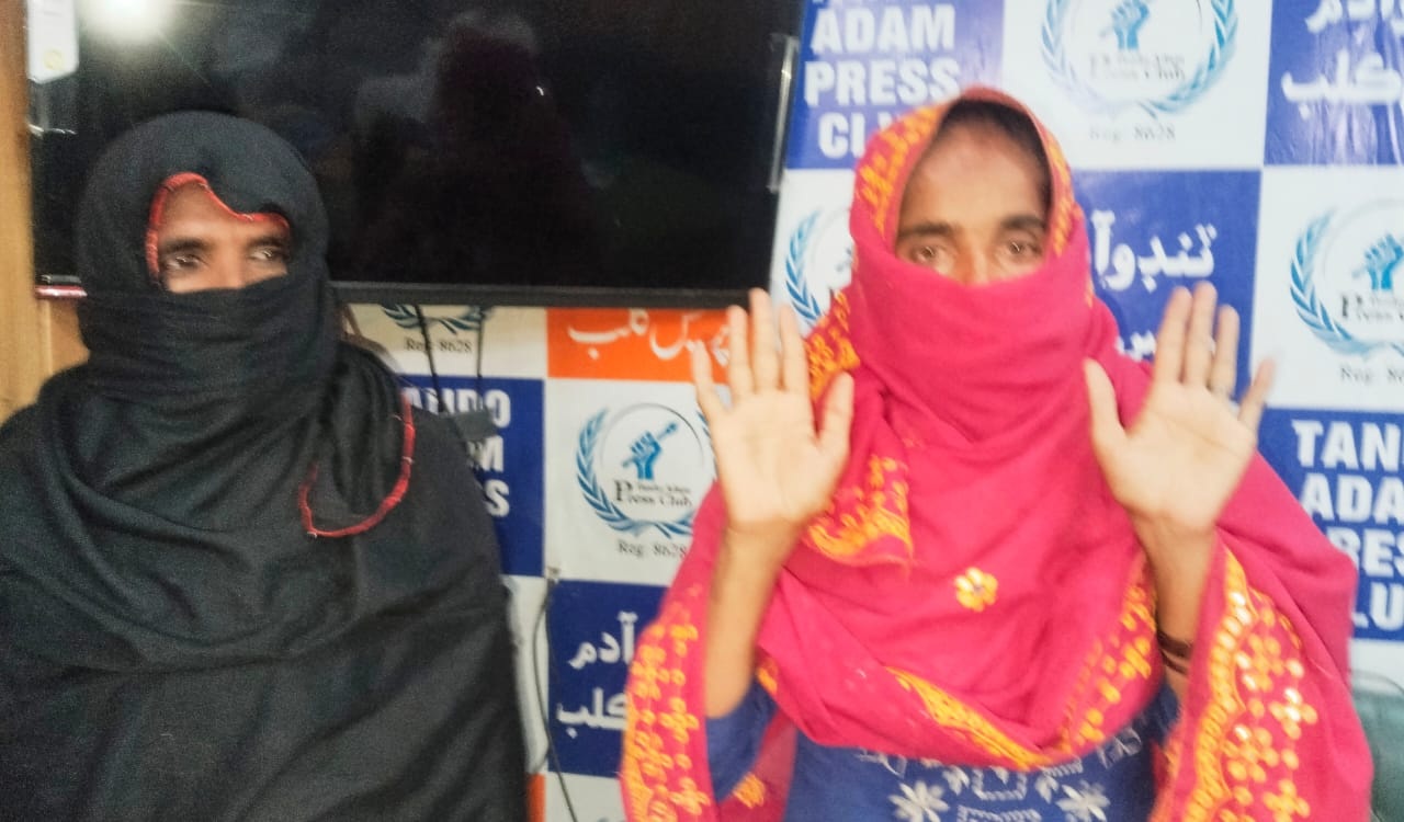 Woman protests against alleged domestic violence in Tando Adam